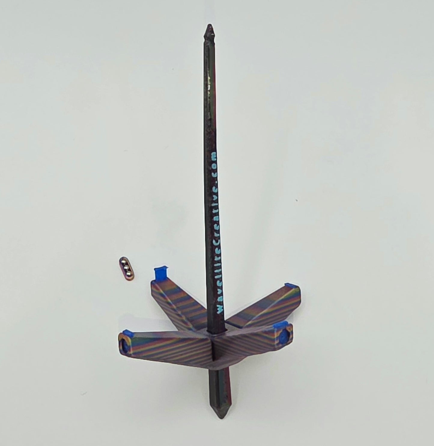 Roaming Wayfinder - Small, rainbow oil slick with blue accents