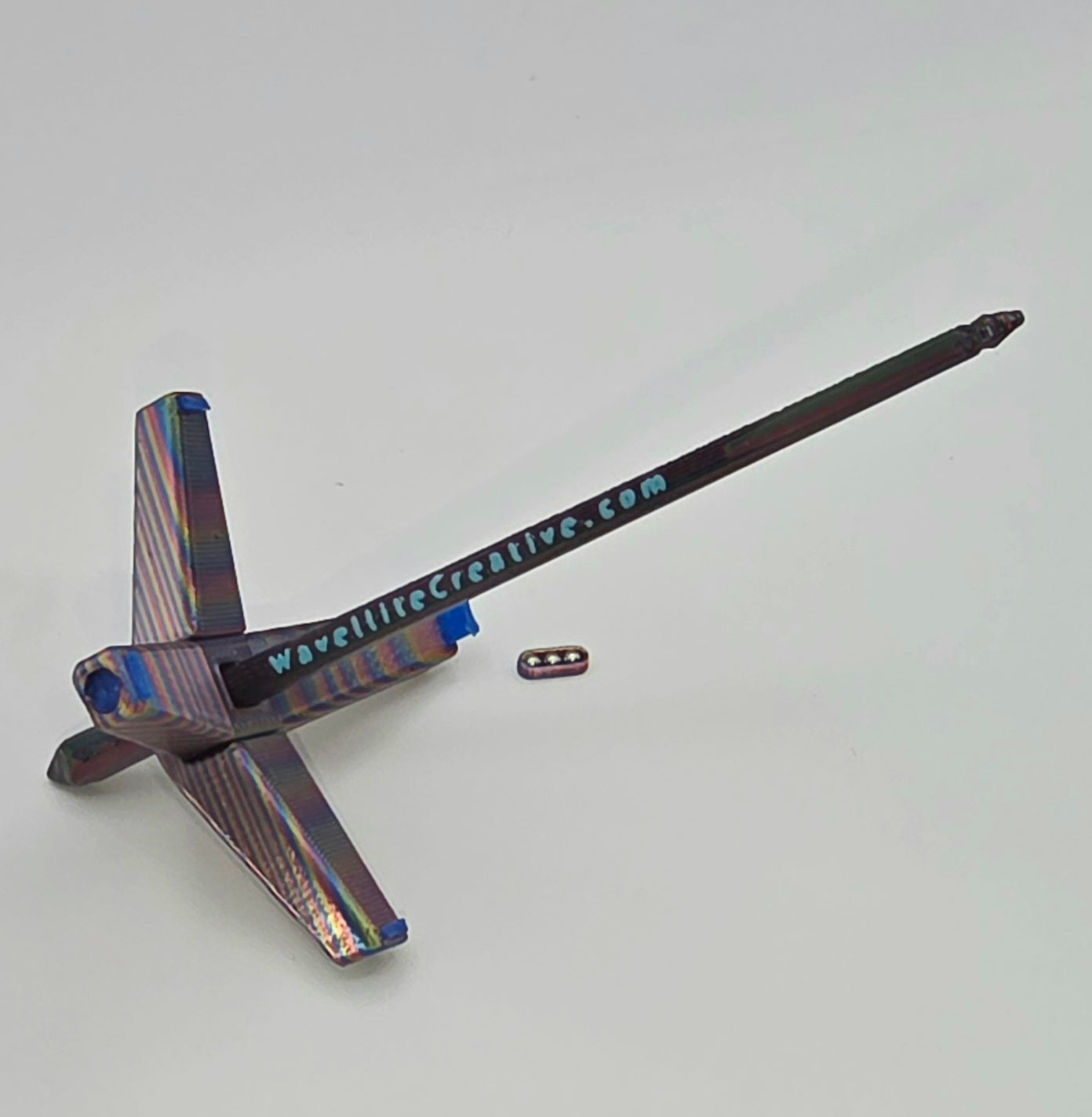 Roaming Wayfinder - Small, rainbow oil slick with blue accents